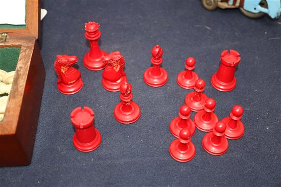 A small Staunton type ivory chess set, in mahogany box, kings 2.5in., missing one red pawn and the red king